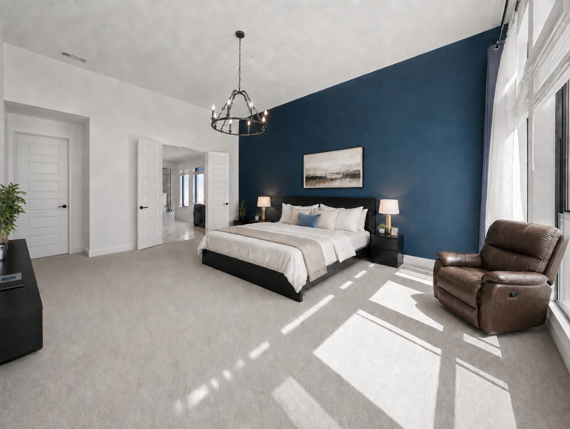 1440 Riva Ridge Drive Leander, TX 78641 - Photo 14 of 37 A spacious primary bedroom features a striking accent wall, plush carpet, and abundant natural light.