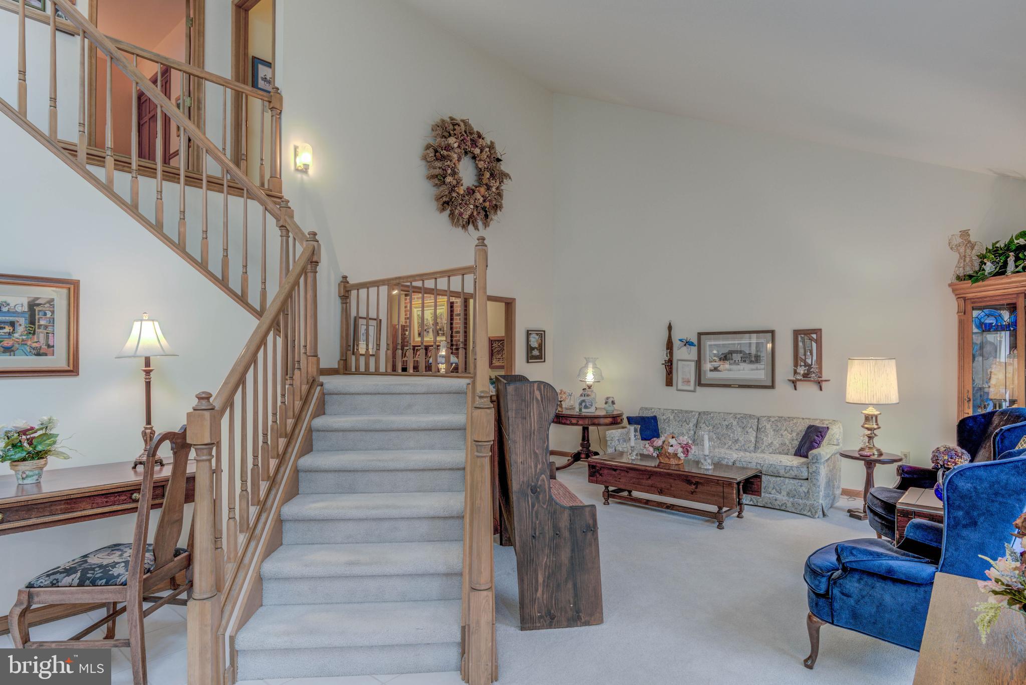 23 Canal Road Ocean Pines, MD 21811 - Photo 4 of 18 Custom staircase highlights the entry hall