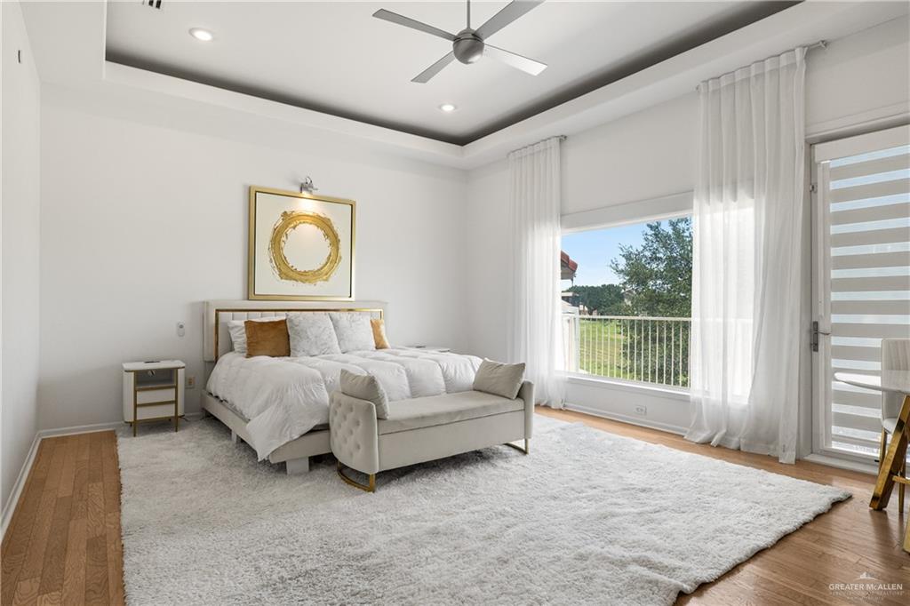 514 Rio Grande Drive Mission, TX 78572 - Photo 12 of 28 a spacious bedroom with a bed painting on wall and windows