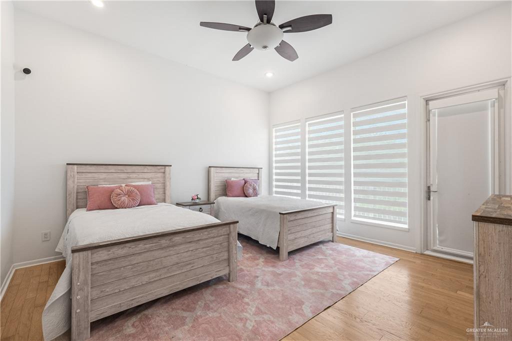 514 Rio Grande Drive Mission, TX 78572 - Photo 16 of 28 a bedroom with a bed and a chandelier