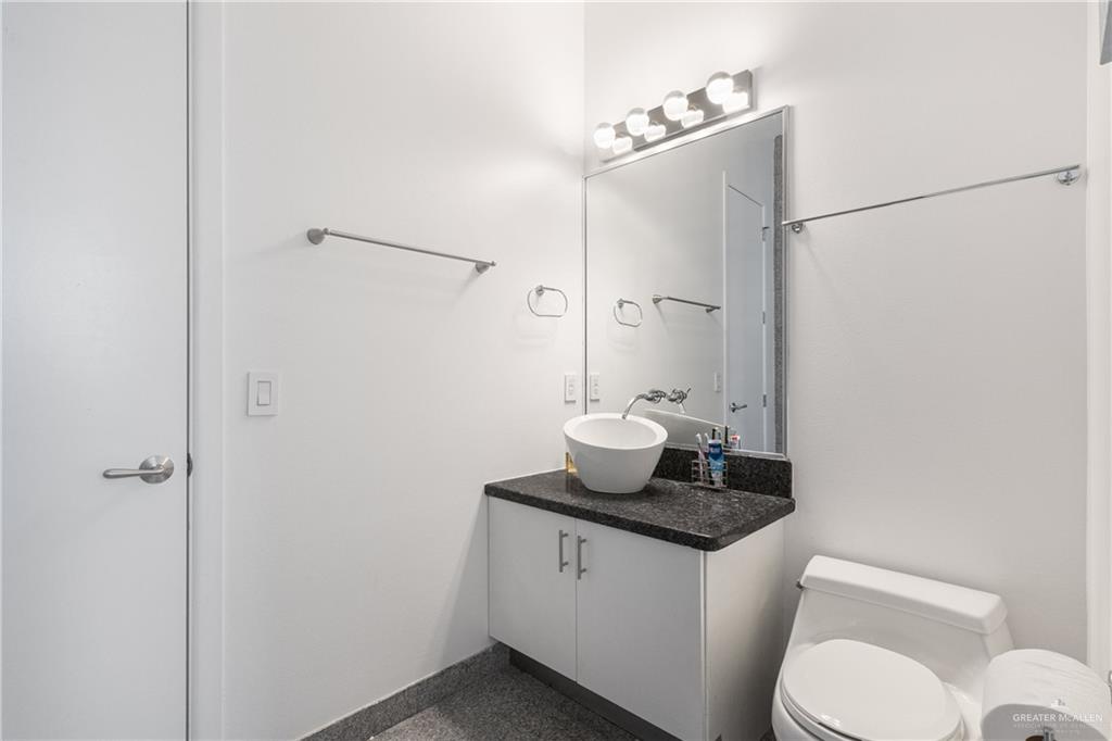 514 Rio Grande Drive Mission, TX 78572 - Photo 19 of 28 a white toilet sitting next to a bathroom sink
