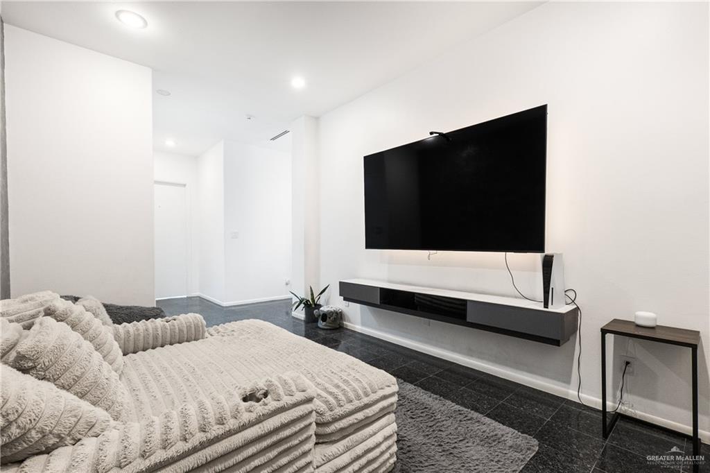 514 Rio Grande Drive Mission, TX 78572 - Photo 20 of 28 a bedroom with a bed and a flat screen tv