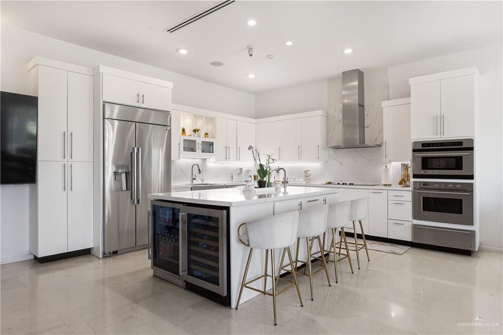 514 Rio Grande Drive Mission, TX 78572 - Photo 8 of 28 a kitchen with a sink stainless steel appliances and cabinets