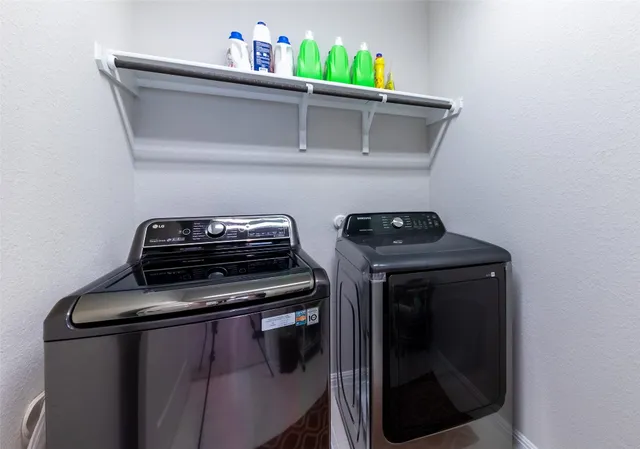 a bathroom with a sink vanity mirror and toilet