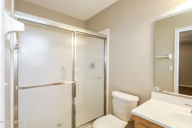 a bathroom with a sink a toilet and bathtub
