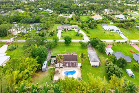 a view of swimming pool from a garden