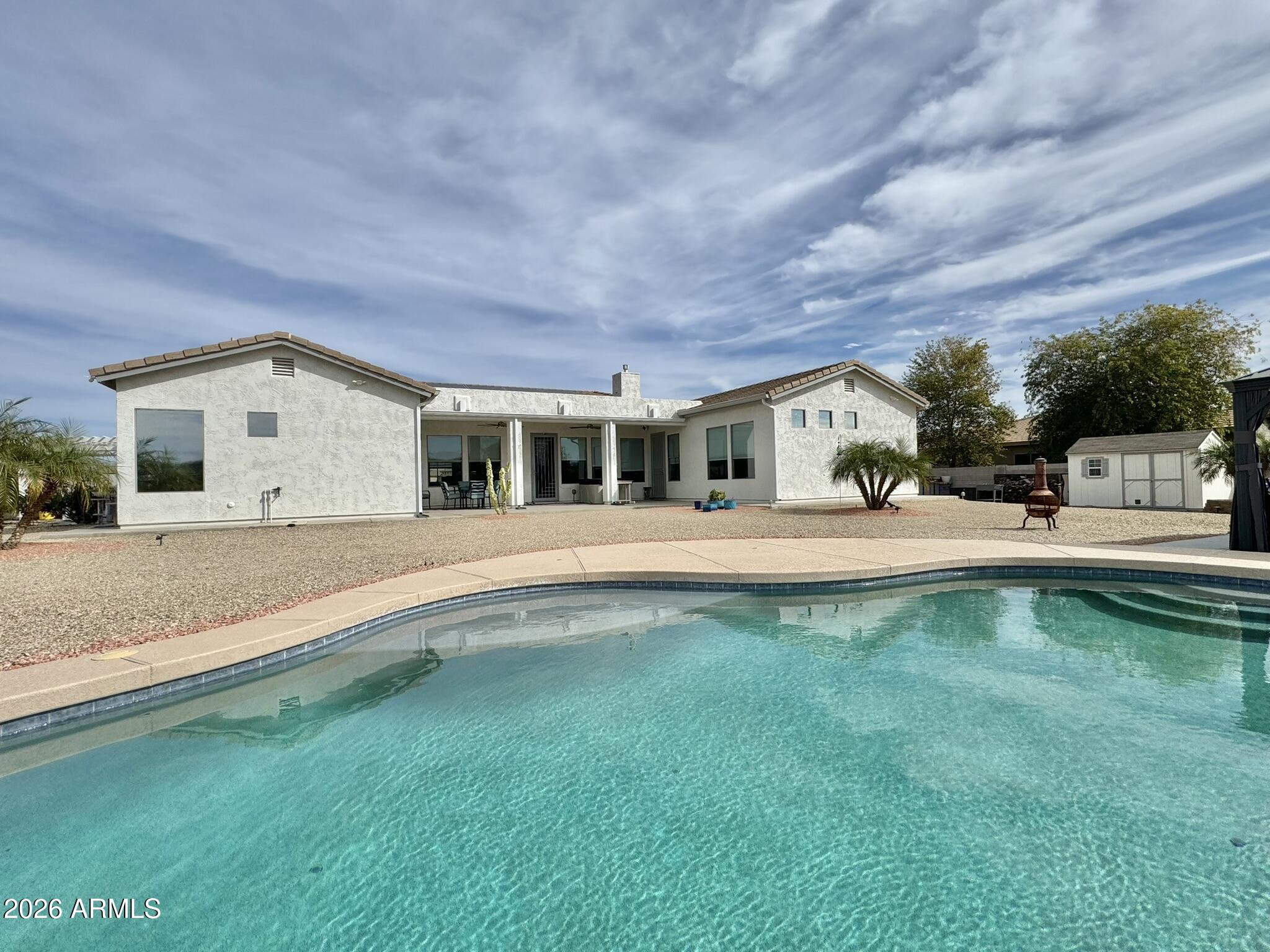 22909 West Sierra Ridge Way Wittmann, AZ 85361 - Photo 110 of 121 a view of house with swimming pool and yard