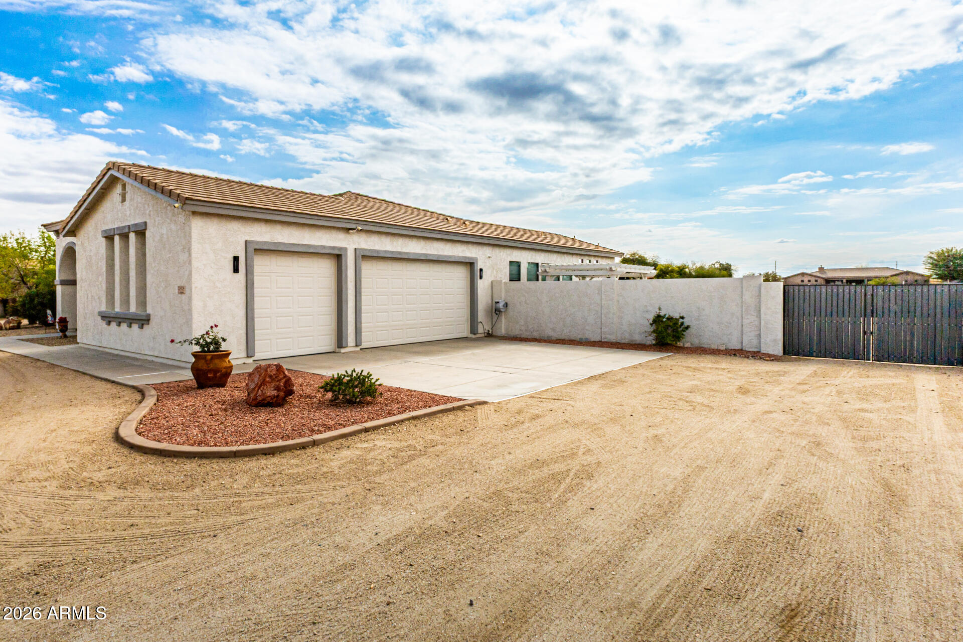 22909 West Sierra Ridge Way Wittmann, AZ 85361 - Photo 115 of 121 a backyard of a house with wooden floor