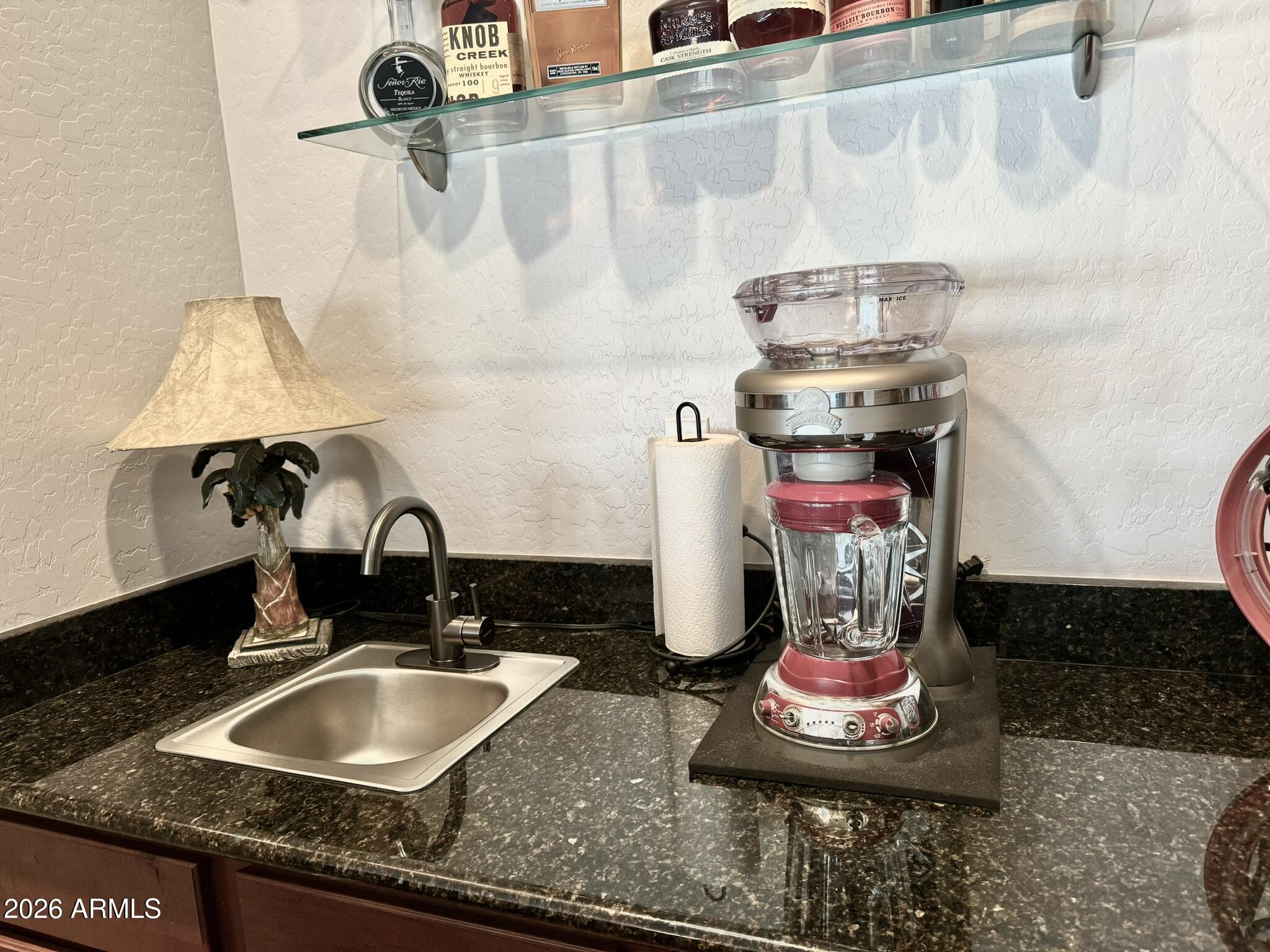 22909 West Sierra Ridge Way Wittmann, AZ 85361 - Photo 26 of 121 a bathroom with a sink and a stove