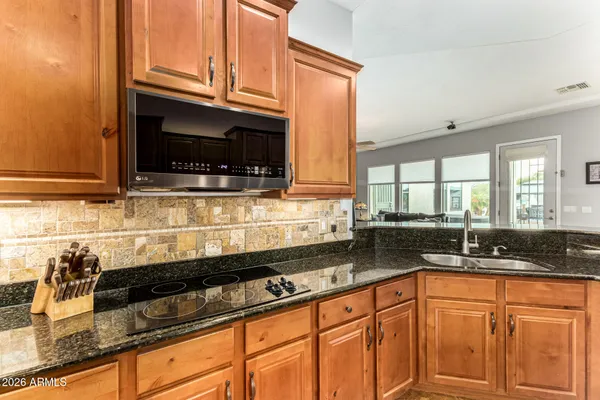 a view of a kitchen with outdoor kitchen