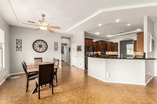 a view of house with swimming pool and yard