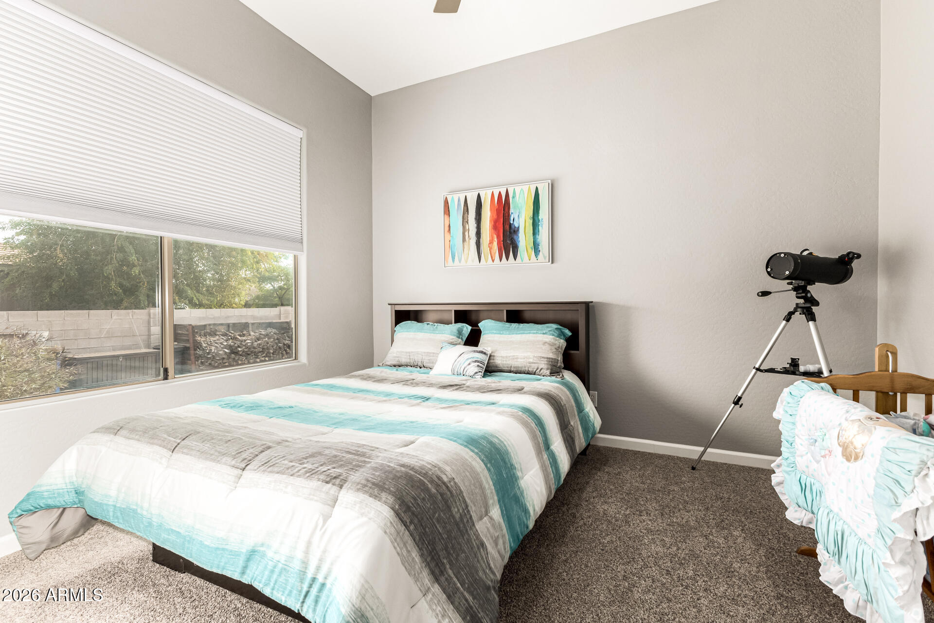 22909 West Sierra Ridge Way Wittmann, AZ 85361 - Photo 57 of 121 a bedroom with a bed and a window