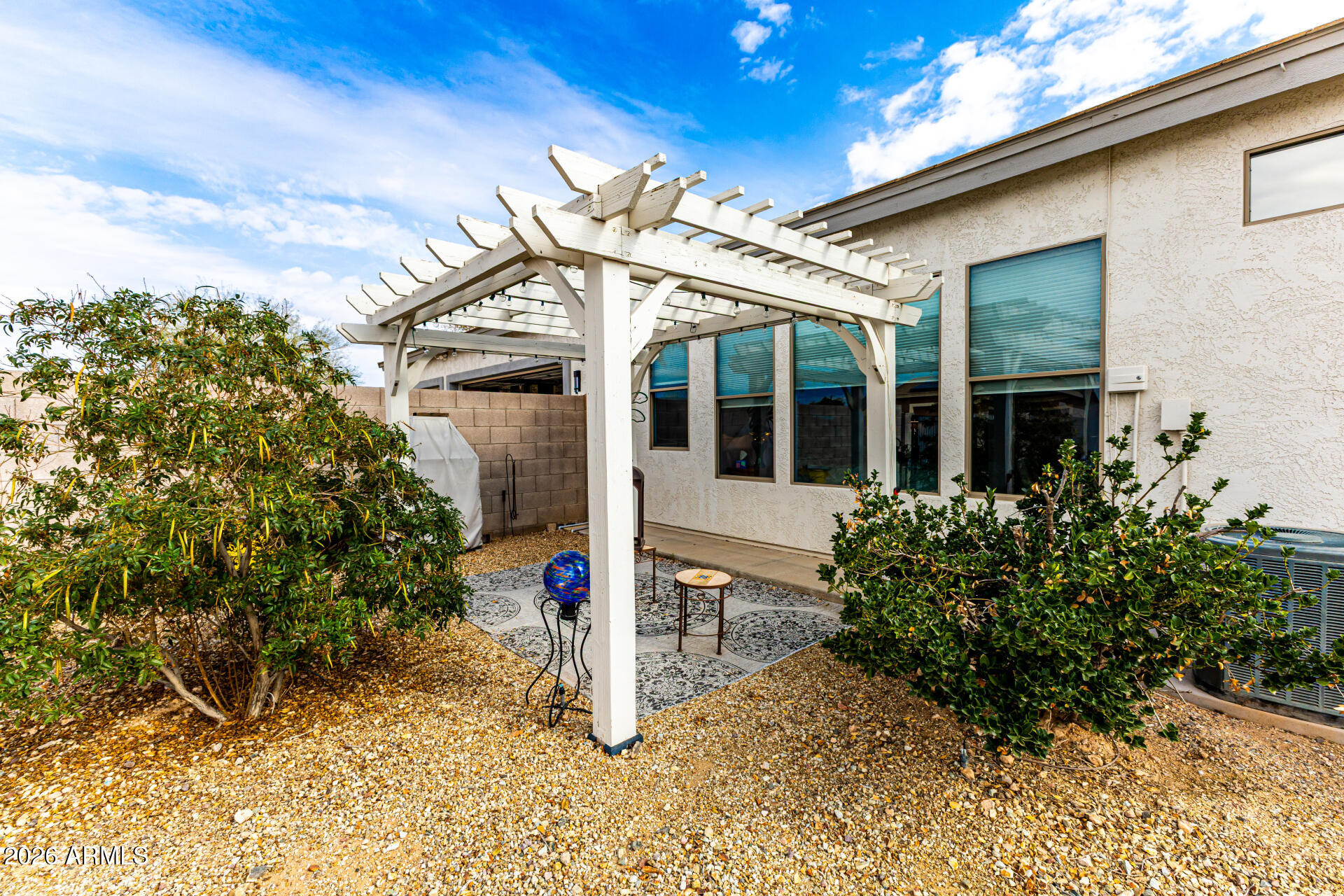 22909 West Sierra Ridge Way Wittmann, AZ 85361 - Photo 77 of 121 front view of a house with a tree