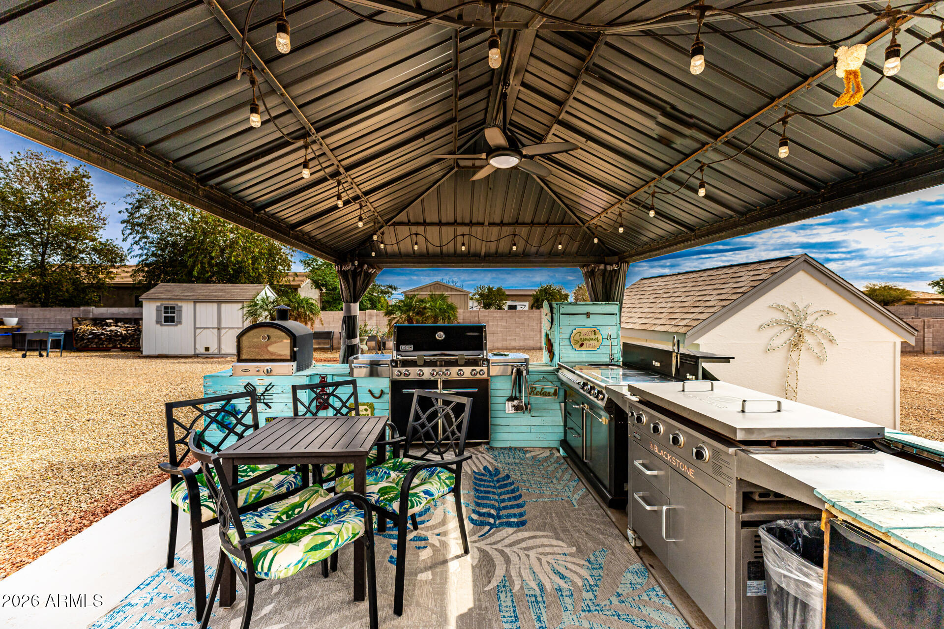 22909 West Sierra Ridge Way Wittmann, AZ 85361 - Photo 6 of 121 a view of a chairs and table in the roof deck