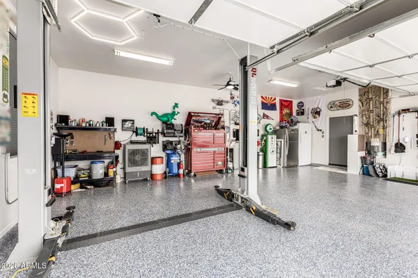 an aerial view of a house with a yard lake view and mountain view