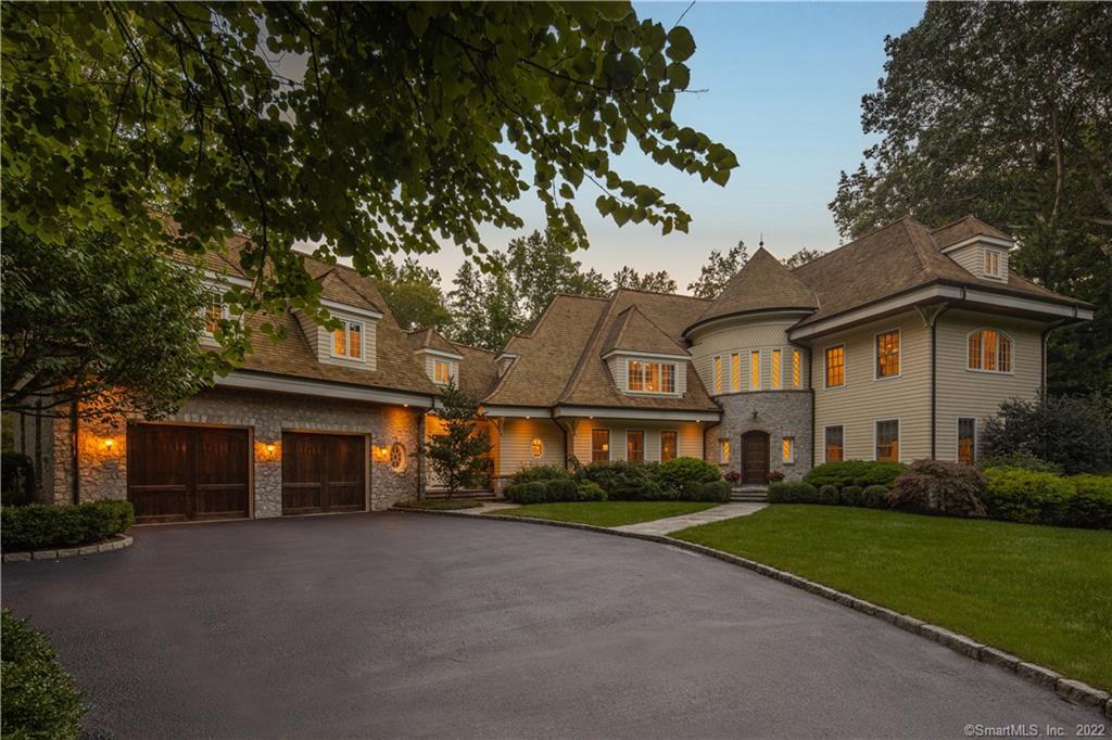 20 Tupelo Road Westport, CT 06880 - Photo 1 of 1 a front view of a house with a yard and garage