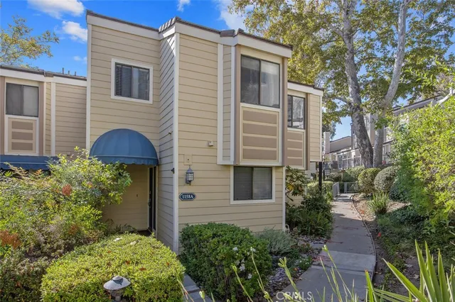 a view front of house with yard and trees
