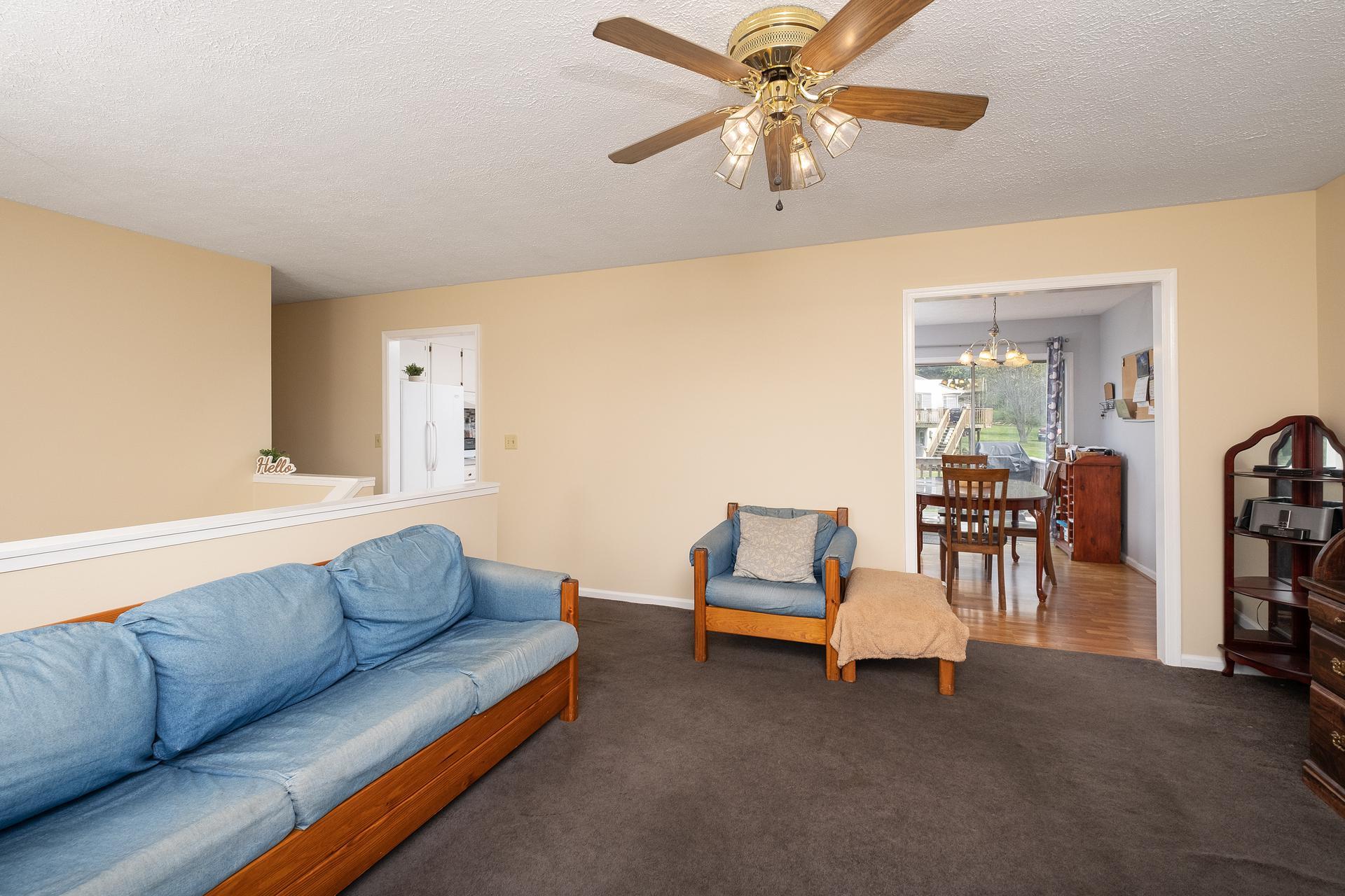 305 Ox Road Waynesboro, VA 22980 - Photo 8 of 28 a living room with furniture and a chandelier