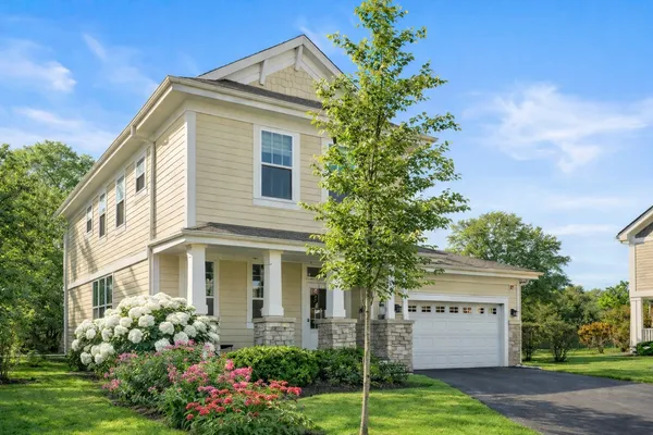 a front view of a house with garden