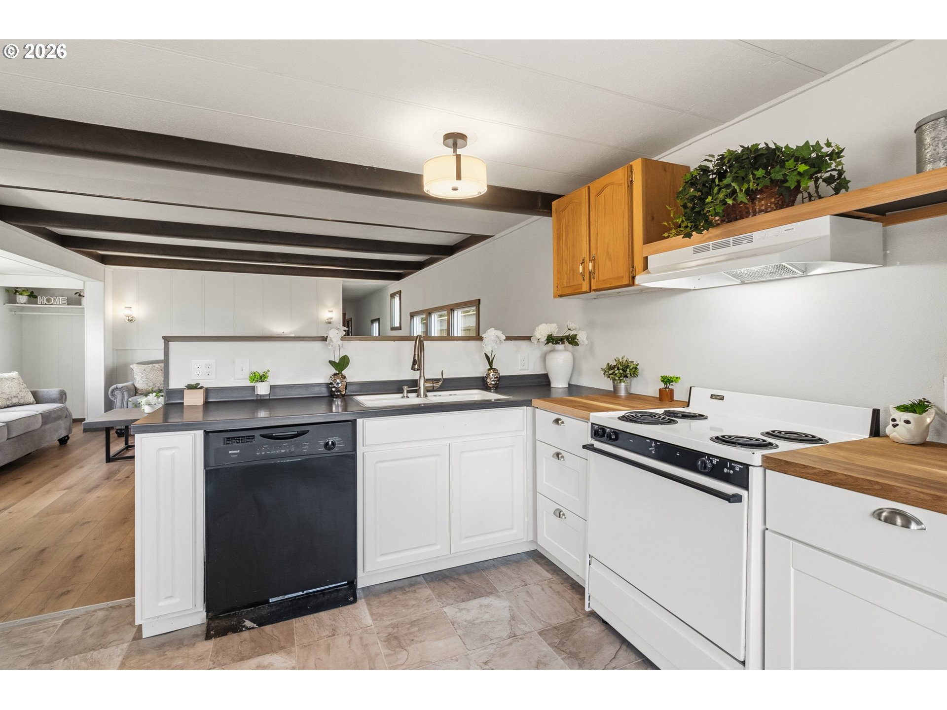 205 South 54th Street, Unit 76 Springfield, OR 97478 - Photo 6 of 41 a kitchen with a sink and cabinets