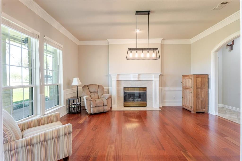 166 East Rio Ridge Azle, TX 76020 - Photo 10 of 40 a living room with furniture and a fireplace