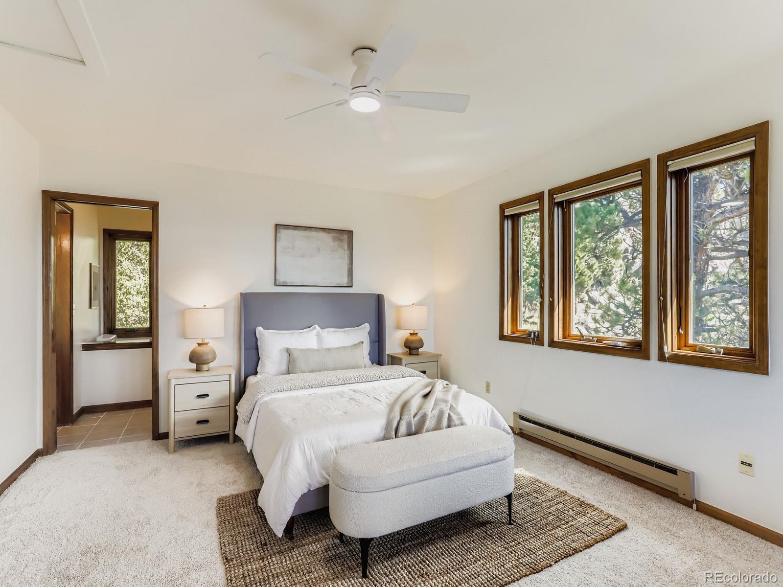 677 Sky Trail Road Boulder, CO 80302 - Photo 14 of 40 a bedroom with a large bed and a window