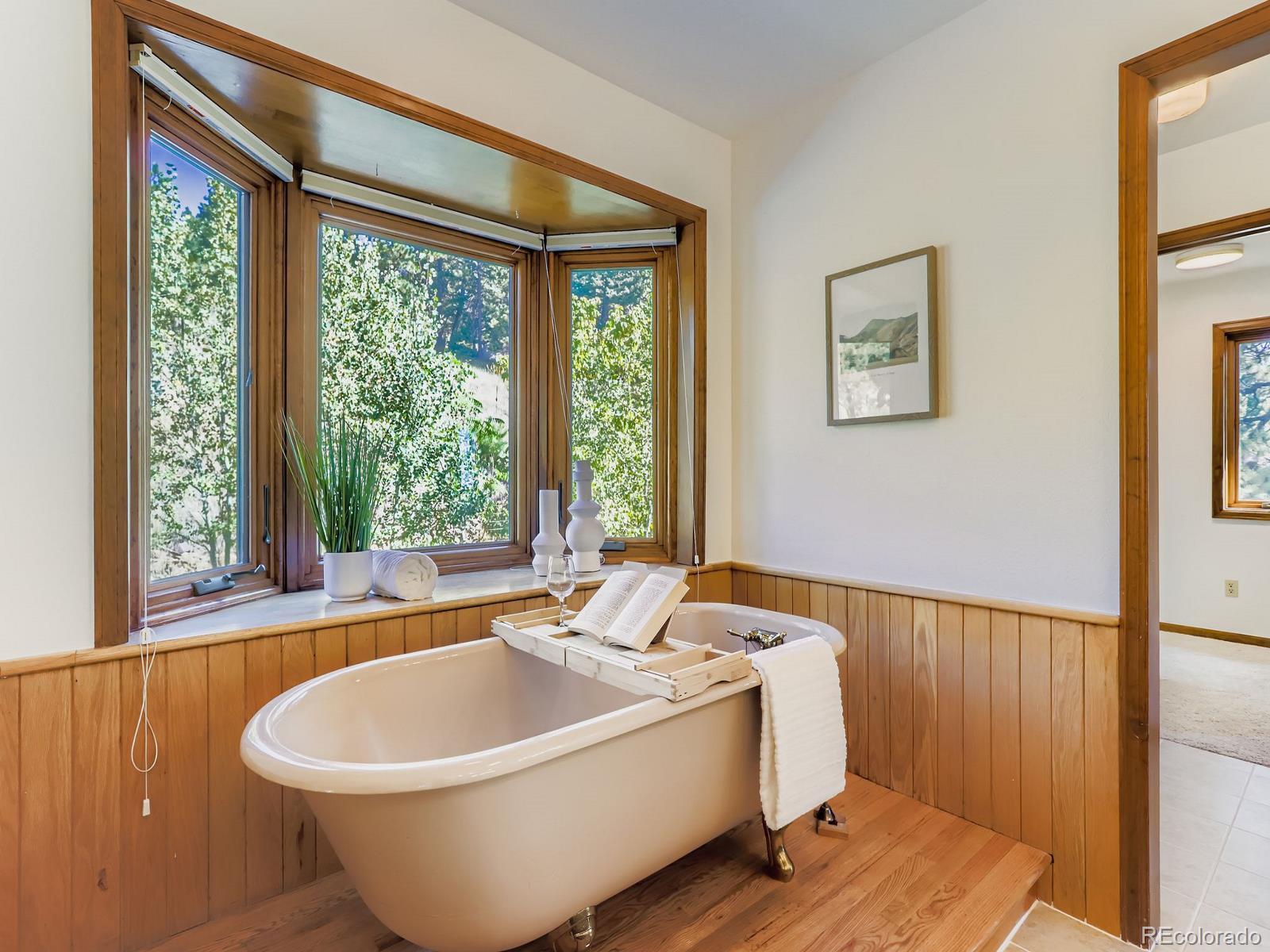 677 Sky Trail Road Boulder, CO 80302 - Photo 17 of 40 a white bath tub sitting next to a window