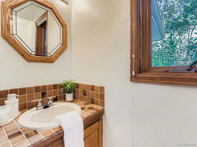 a view of outdoor space with wooden floor and city view
