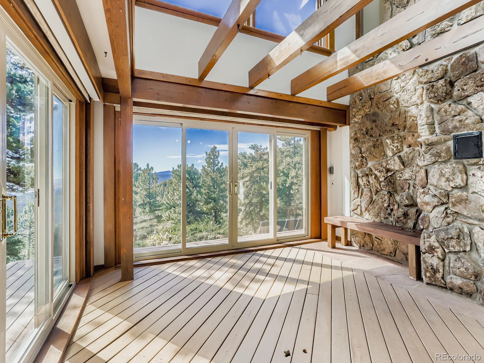 677 Sky Trail Road Boulder, CO 80302 - Photo 20 of 40 a view of outdoor space with wooden floor and city view
