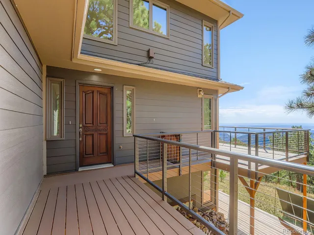 a view of a balcony with wooden floor