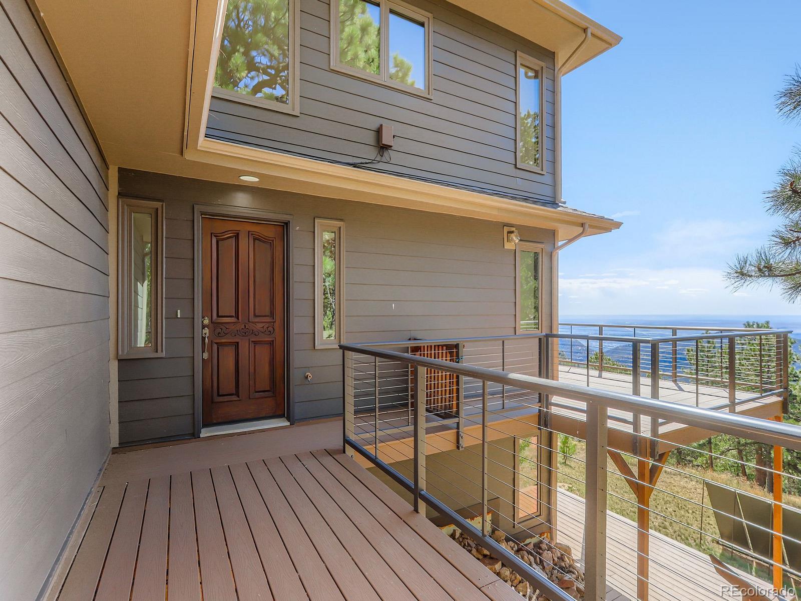 677 Sky Trail Road Boulder, CO 80302 - Photo 2 of 40 a view of a balcony with wooden floor