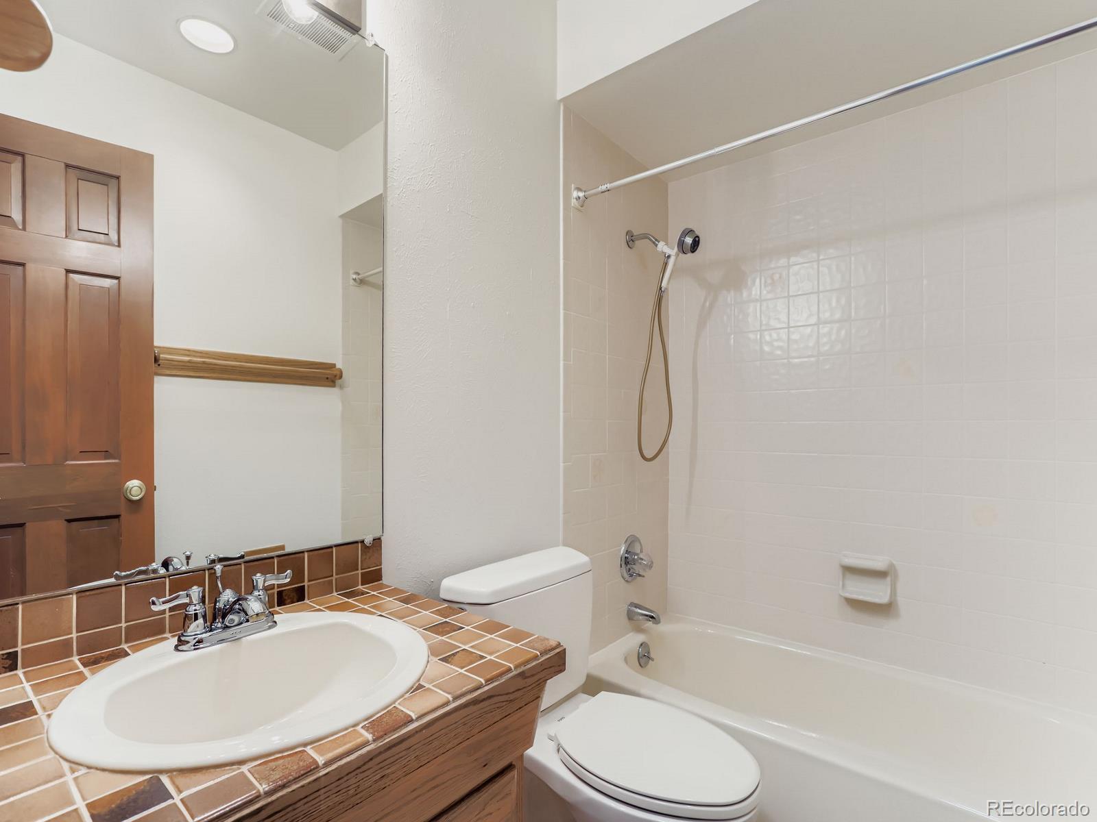 677 Sky Trail Road Boulder, CO 80302 - Photo 23 of 40 a bathroom with a sink toilet and shower