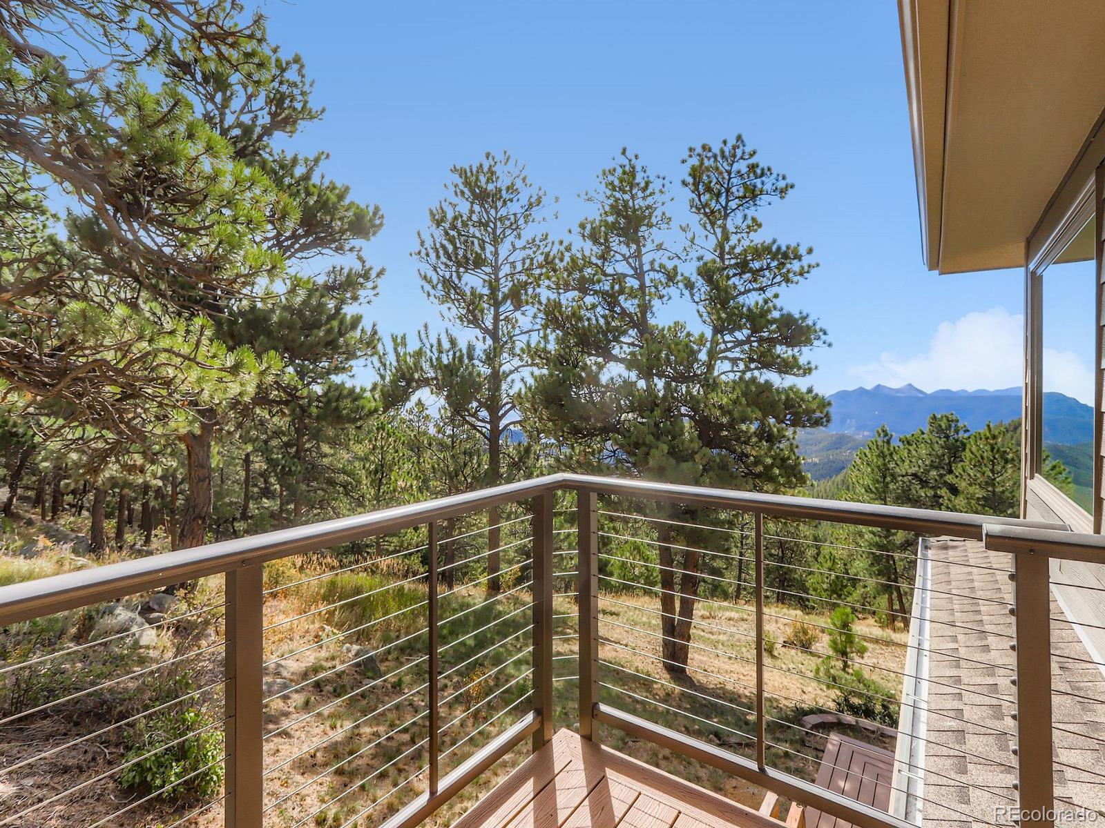 677 Sky Trail Road Boulder, CO 80302 - Photo 24 of 40 a view of a balcony with trees