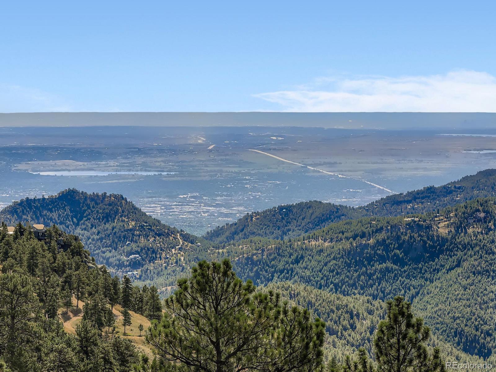 677 Sky Trail Road Boulder, CO 80302 - Photo 4 of 40 a view of an ocean beach and mountain