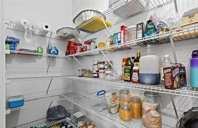 a kitchen with a refrigerator and a stove