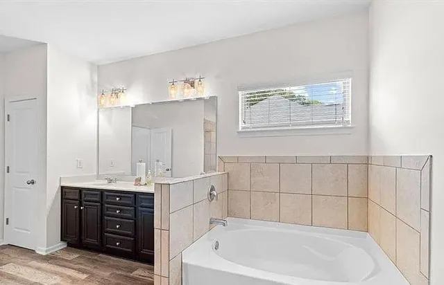 a bedroom with a bed and furniture