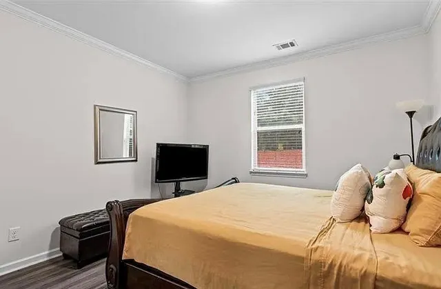 a view of a balcony with wooden floor