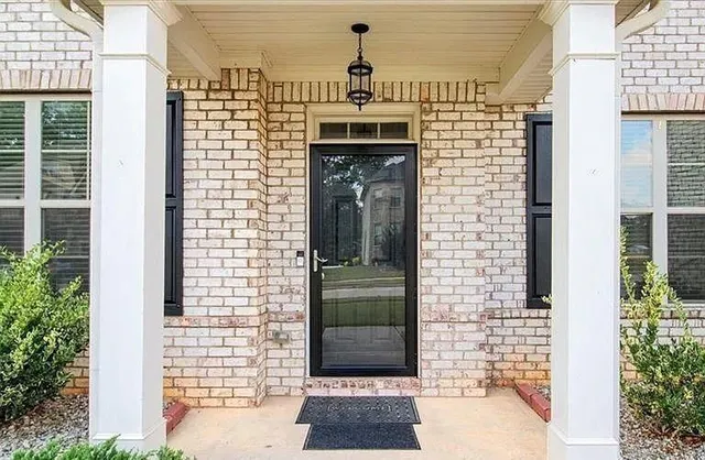 a front view of a house with a door