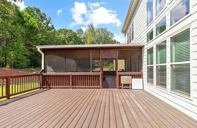 an aerial view of residential house with outdoor space and swimming pool