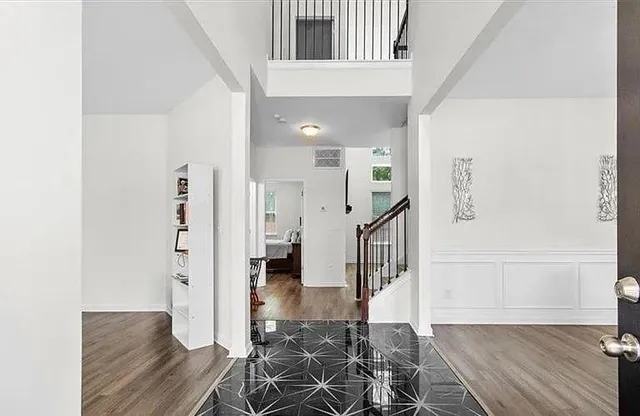 a view of entryway with wooden floor