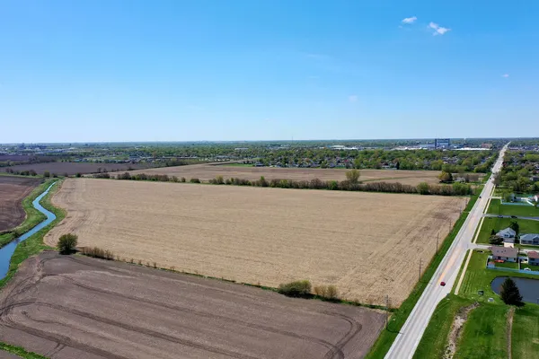 a view of a lake with houses in the back