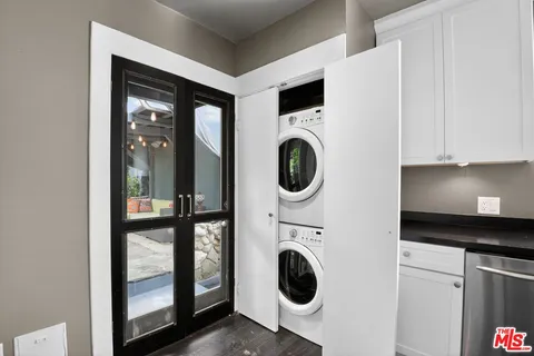 a view of a kitchen with washer and dryer