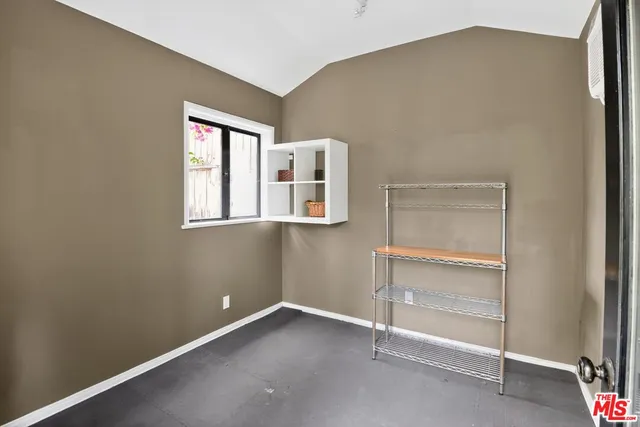 a room that has a window and white walls