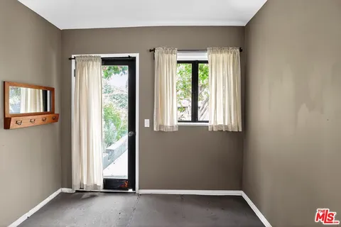 an empty room with windows