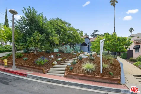 a view of a backyard with sitting area