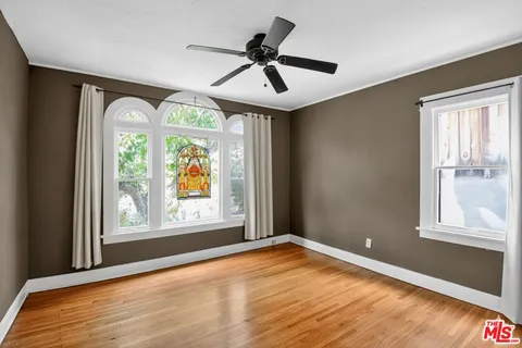 a view of empty room with a large window