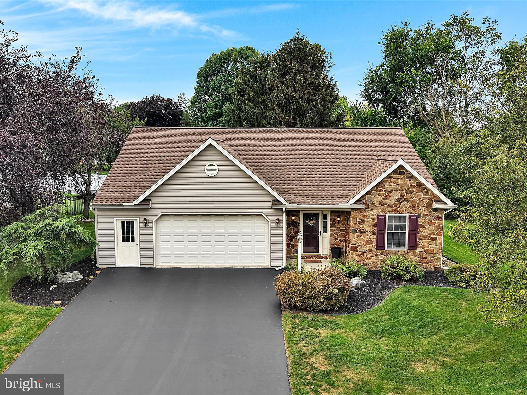 front view of a house with a yard