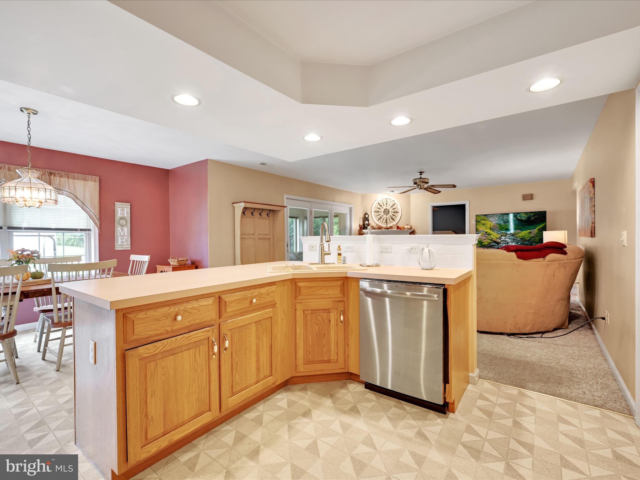 21 Silver Creek Road Lititz, PA 17543 - Photo 17 of 37 a large white kitchen with kitchen island a sink a stove and a refrigerator