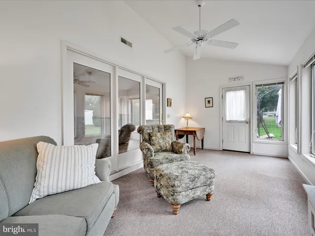 a living room with furniture and window