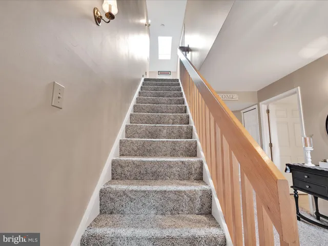 a view of a livingroom with furniture and a window